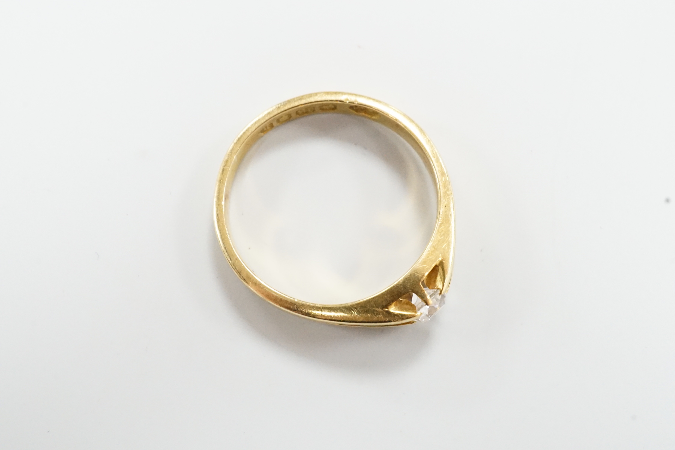A George V 18ct gold and claw set solitaire diamond ring, size R, gross weight 5.1 grams.